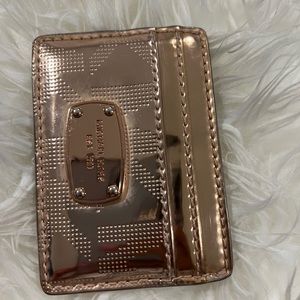 Micheal Kors Rose gold card holder.